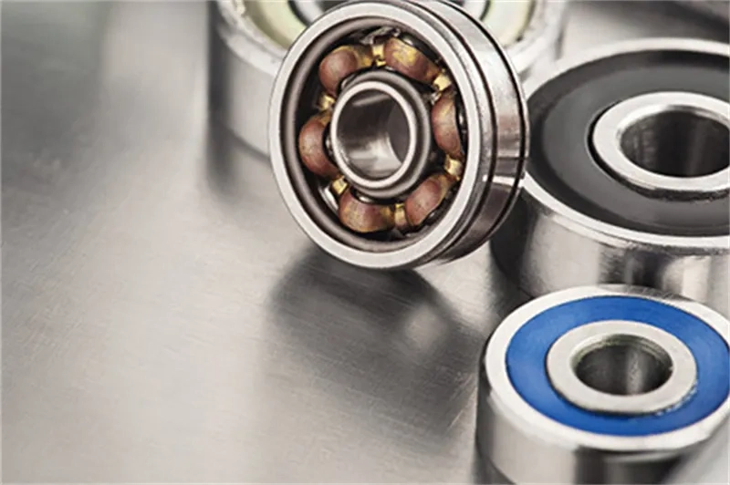 How do preload and rotational speed affect bearing stiffness?